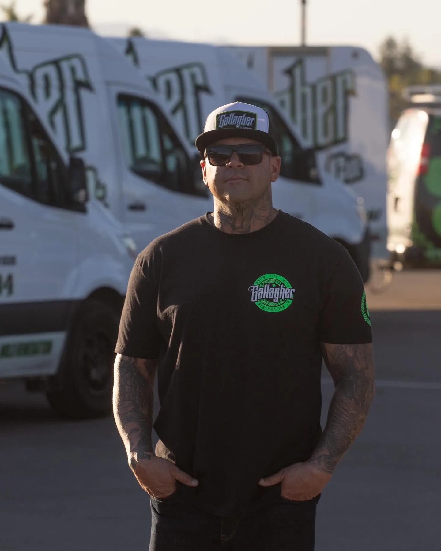 Aaron Gallagher — founder and owner of Gallagher Restoration — in front of the company fleet in Canyon Lake, California