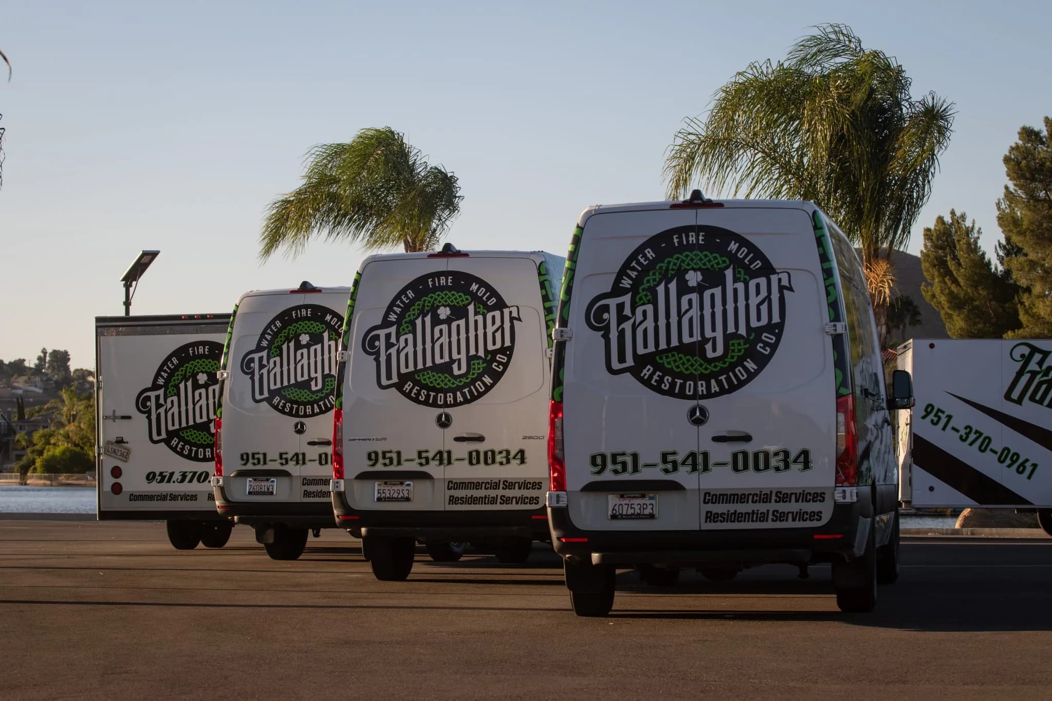 The Gallagher family in front of a company van